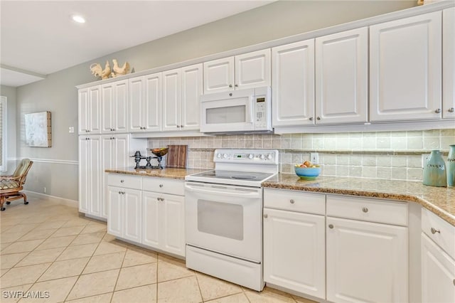 9121 Southmont Cv Unit 204, Fort Myers, FL 33908 - kitchen featuring white appliances, light tile patterned floors, decorative backsplash, white cabinetry, and recessed lighting