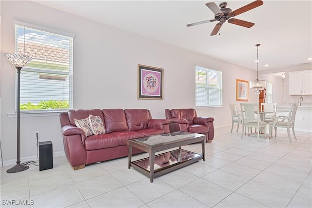 2113 Summersweet Dr, Alva, FL 33920 - living room with light tile patterned floors, a ceiling fan, a chandelier, and recessed lighting