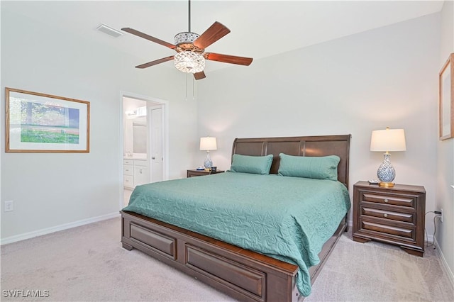 2113 Summersweet Dr, Alva, FL 33920 - bedroom with light colored carpet, ensuite bath, and a ceiling fan