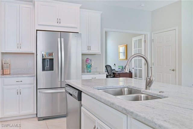 2113 Summersweet Dr, Alva, FL 33920 - kitchen featuring stainless steel appliances, white cabinets, light tile patterned flooring, and light stone counters