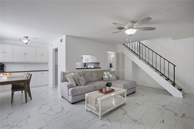 3297 Royal Canadian Trce Unit 2, Fort Myers, FL 33907 - living area featuring light marble finish flooring, stairs, a ceiling fan, and baseboards