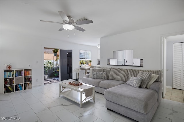 3297 Royal Canadian Trce Unit 2, Fort Myers, FL 33907 - living room featuring light marble finish flooring, a ceiling fan, and baseboards