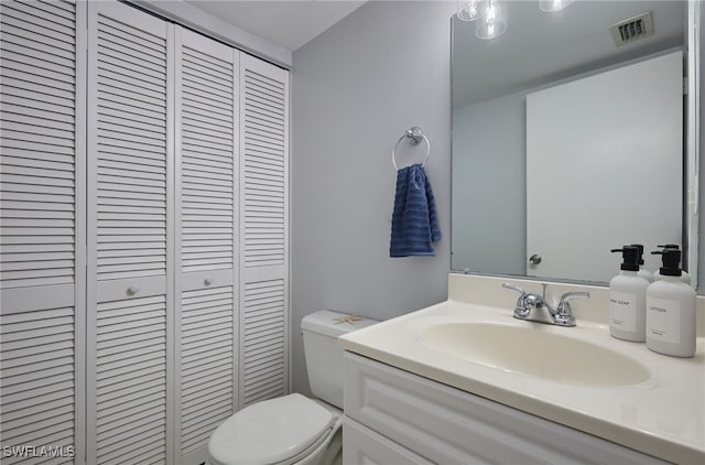 3297 Royal Canadian Trce Unit 2, Fort Myers, FL 33907 - bathroom with a closet, toilet, and vanity