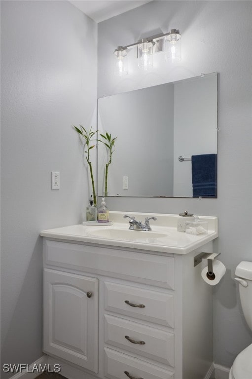 3297 Royal Canadian Trce Unit 2, Fort Myers, FL 33907 - half bath featuring vanity and toilet