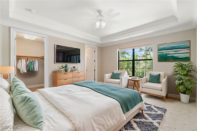 2768 Tiburon Blvd E Unit 202, Naples, FL 34109 - bedroom with a raised ceiling, crown molding, light colored carpet, a closet, and ceiling fan