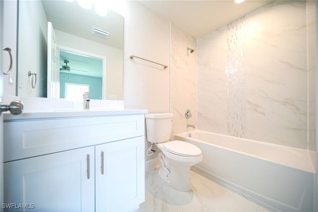 128 Sanborn Dr, Lehigh Acres, FL 33972 - full bathroom with vanity, toilet, bathtub / shower combination, marble finish floors, and ceiling fan