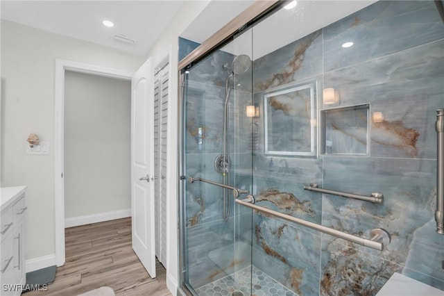 5301 SW 8th Pl, Cape Coral, FL 33914 - full bathroom with vanity, a stall shower, wood finished floors, and baseboards