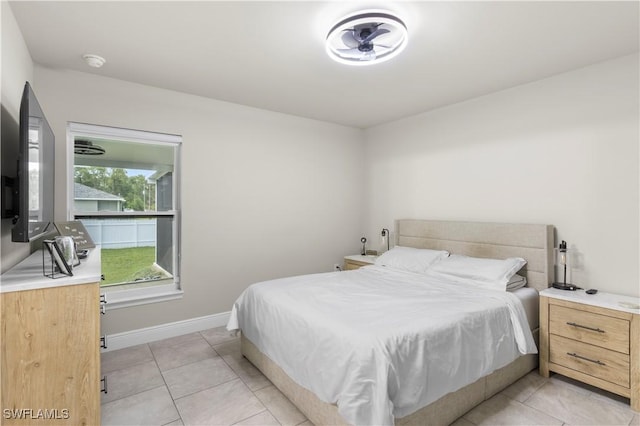 3214 45th St W, Lehigh Acres, FL 33971 - bedroom with light tile patterned floors and baseboards