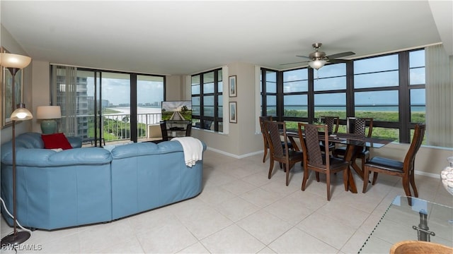 440 Seaview Ct Unit 611, Marco Island, FL 34145 - living room featuring a ceiling fan and light tile patterned floors