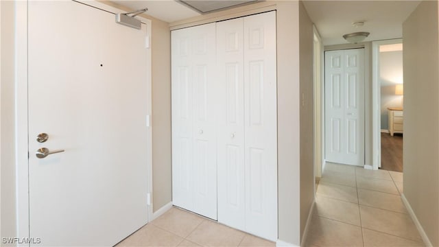 440 Seaview Ct Unit 611, Marco Island, FL 34145 - unfurnished bedroom with light tile patterned flooring and a closet