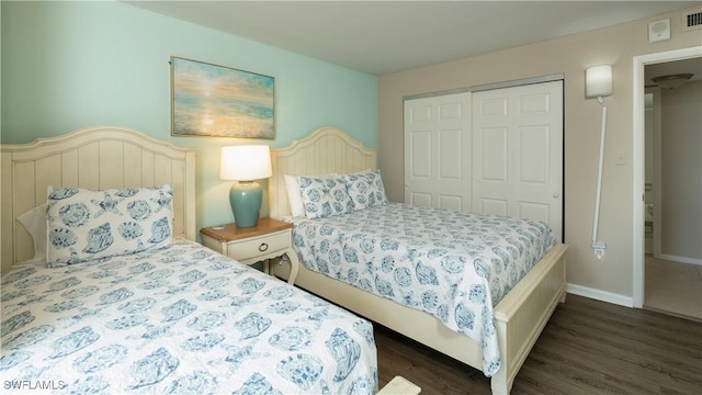 440 Seaview Ct Unit 611, Marco Island, FL 34145 - bedroom featuring a closet and dark wood-style floors