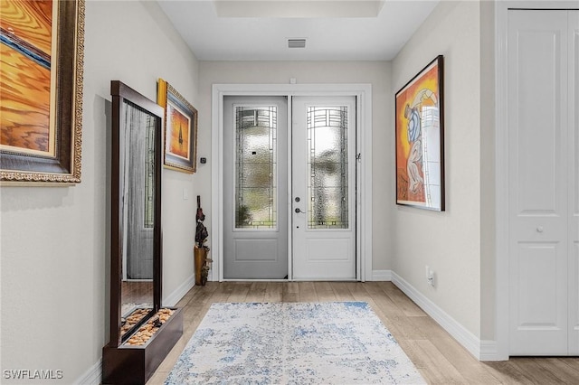2220 Isle Of Pines Ave, Fort Myers, FL 33905 - foyer entrance with light wood finished floors and baseboards