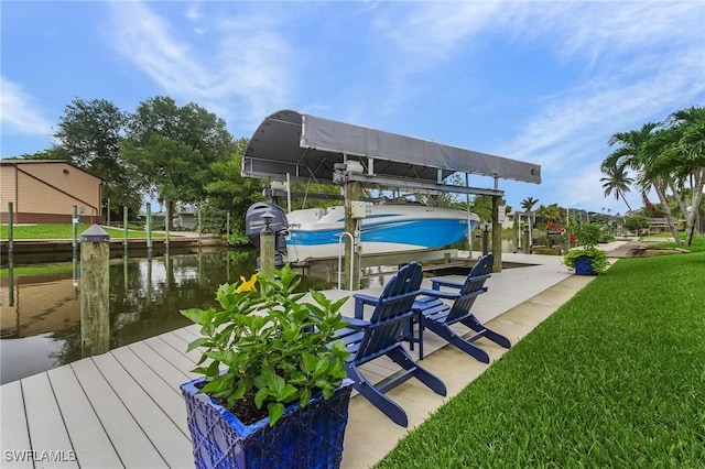 2220 Isle Of Pines Ave, Fort Myers, FL 33905 - dock featuring boat lift, a water view, and a lawn