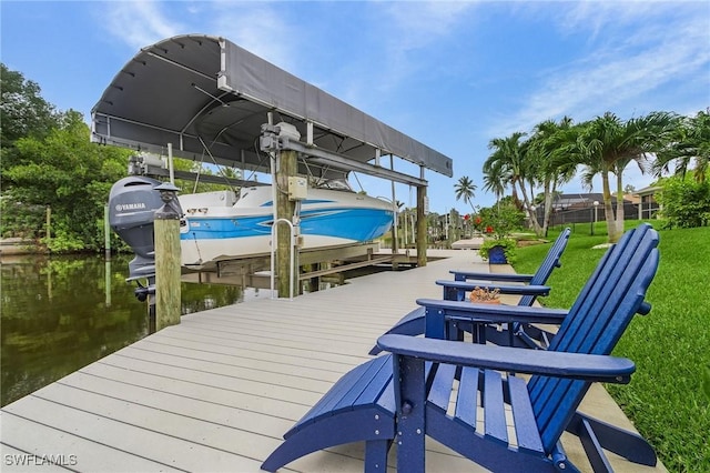 2220 Isle Of Pines Ave, Fort Myers, FL 33905 - dock featuring boat lift, a water view, and a lawn