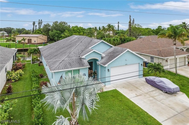 2220 Isle Of Pines Ave, Fort Myers, FL 33905 - ranch-style house featuring concrete driveway, stucco siding, a garage, and a shingled roof