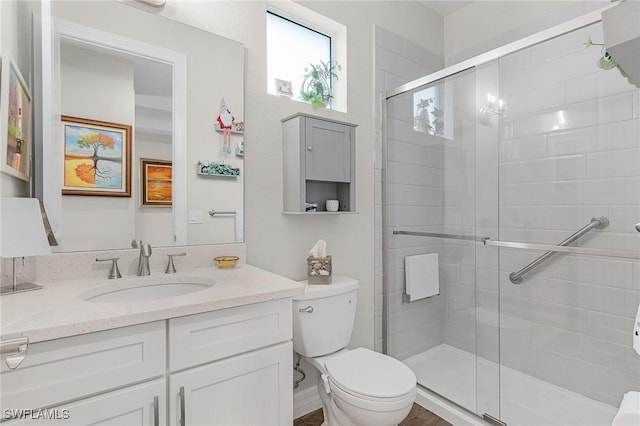 2220 Isle Of Pines Ave, Fort Myers, FL 33905 - bathroom featuring toilet, vanity, and a shower stall