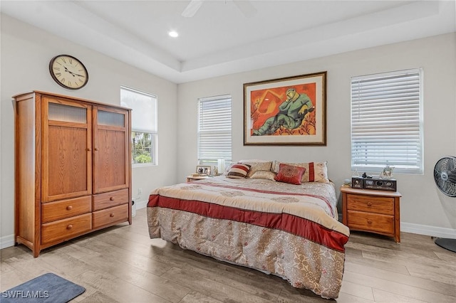 2220 Isle Of Pines Ave, Fort Myers, FL 33905 - bedroom featuring a raised ceiling, light wood-style floors, baseboards, recessed lighting, and ceiling fan