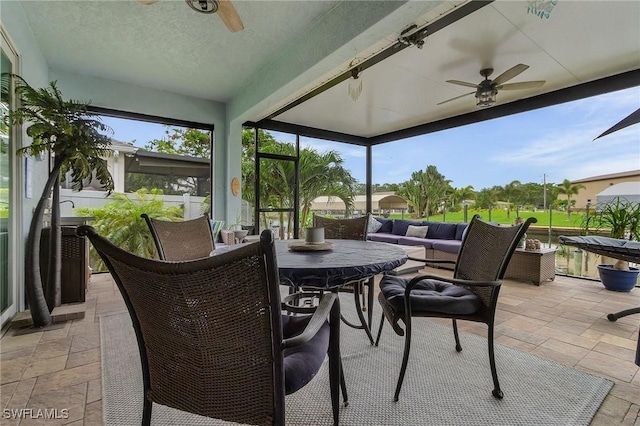2220 Isle Of Pines Ave, Fort Myers, FL 33905 - sunroom featuring a ceiling fan and outdoor dining space