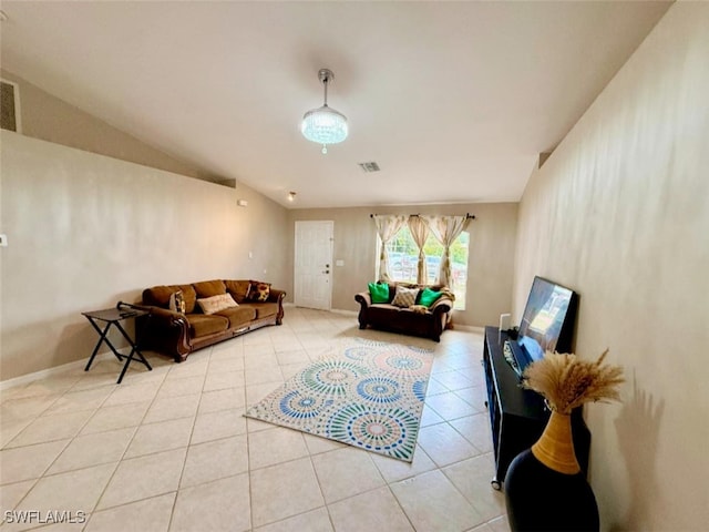 29 Alabama Rd N, Lehigh Acres, FL 33936 - living room featuring light tile patterned flooring, baseboards, and vaulted ceiling