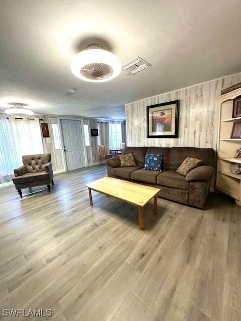 261 Redlin St, North Fort Myers, FL 33903 - living area with light wood finished floors