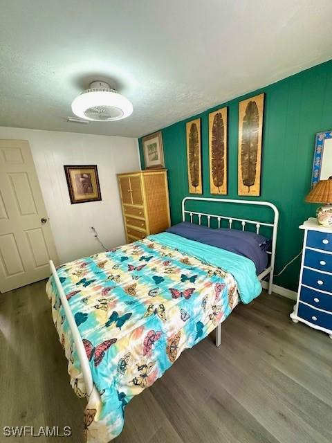261 Redlin St, North Fort Myers, FL 33903 - bedroom with wood finished floors and baseboards