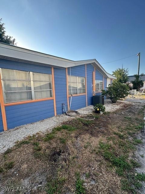 261 Redlin St, North Fort Myers, FL 33903 - view of property exterior featuring central AC unit