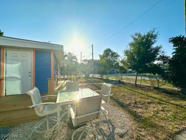 261 Redlin St, North Fort Myers, FL 33903 - view of patio featuring outdoor dining area