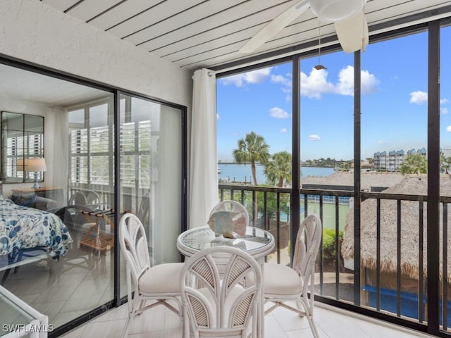 1019 Anglers Cv Unit F302, Marco Island, FL 34145 - sunroom / solarium with a water view, tile patterned floors, and plenty of natural light