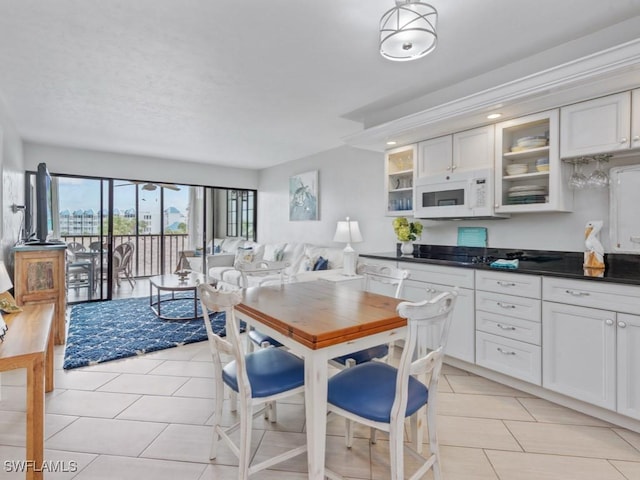 1019 Anglers Cv Unit F302, Marco Island, FL 34145 - dining area with light tile patterned flooring