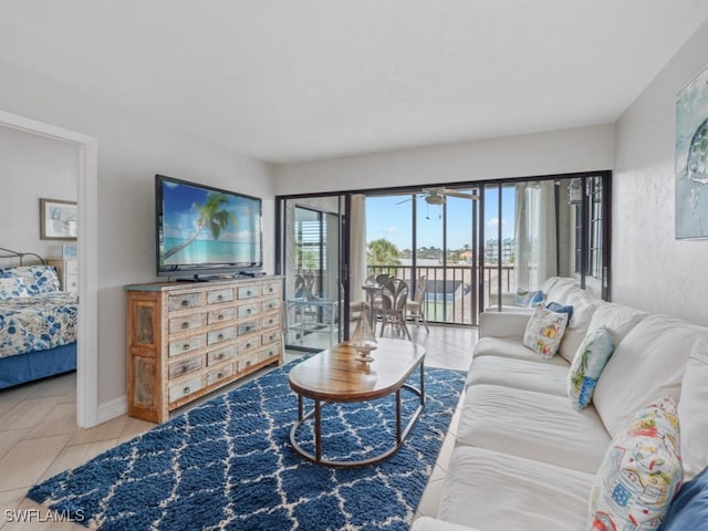 1019 Anglers Cv Unit F302, Marco Island, FL 34145 - tiled living area featuring a ceiling fan and baseboards