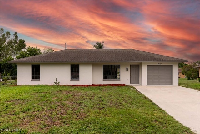 4779 31st Pl SW, Naples, FL 34116 - ranch-style house with stucco siding, an attached garage, concrete driveway, and a lawn