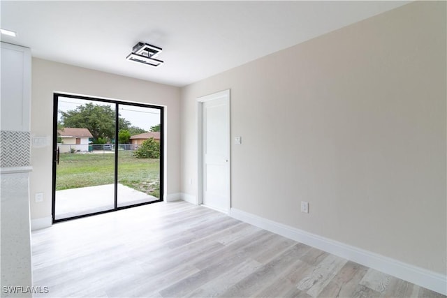 4779 31st Pl SW, Naples, FL 34116 - unfurnished room with light wood-type flooring and baseboards