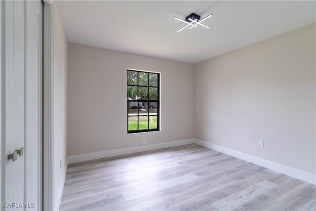 4779 31st Pl SW, Naples, FL 34116 - empty room with light wood-style floors and baseboards