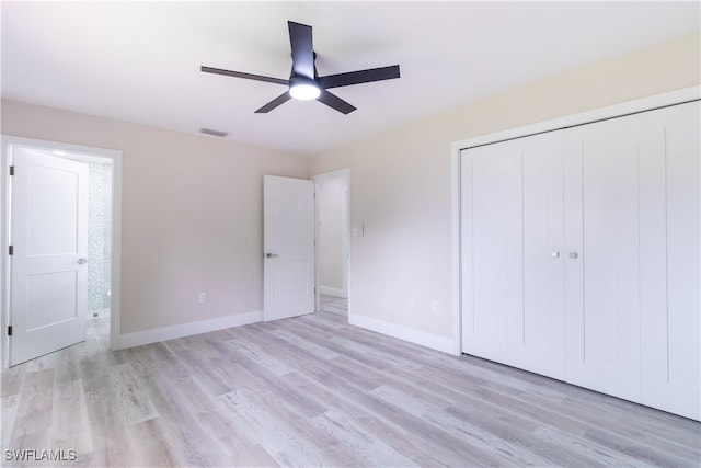 4779 31st Pl SW, Naples, FL 34116 - unfurnished bedroom featuring light wood-style floors, a closet, baseboards, and ceiling fan