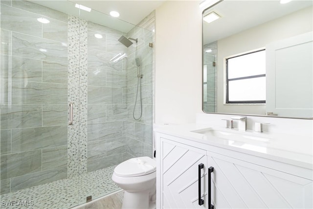 4779 31st Pl SW, Naples, FL 34116 - bathroom with toilet, vanity, a shower stall, recessed lighting, and wood finished floors