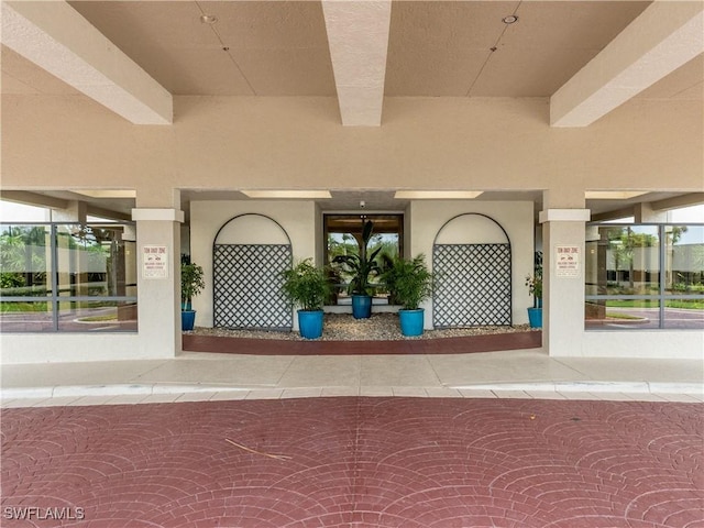 100 N Collier Blvd Unit 803, Marco Island, FL 34145 - doorway to property featuring stucco siding