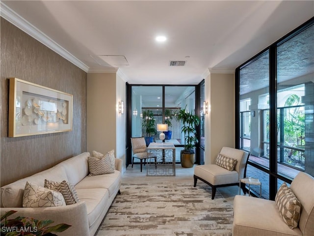 100 N Collier Blvd Unit 803, Marco Island, FL 34145 - living area with a wall of windows, light wood finished floors, and crown molding