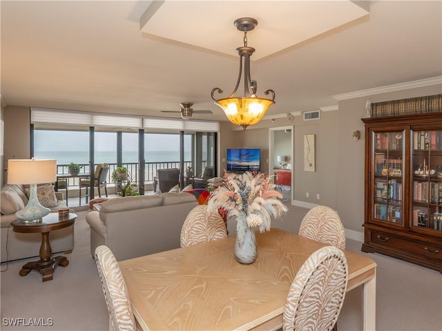 100 N Collier Blvd Unit 803, Marco Island, FL 34145 - dining room featuring carpet, crown molding, and a ceiling fan