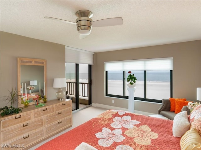 100 N Collier Blvd Unit 803, Marco Island, FL 34145 - bedroom featuring access to exterior, a textured ceiling, and ceiling fan