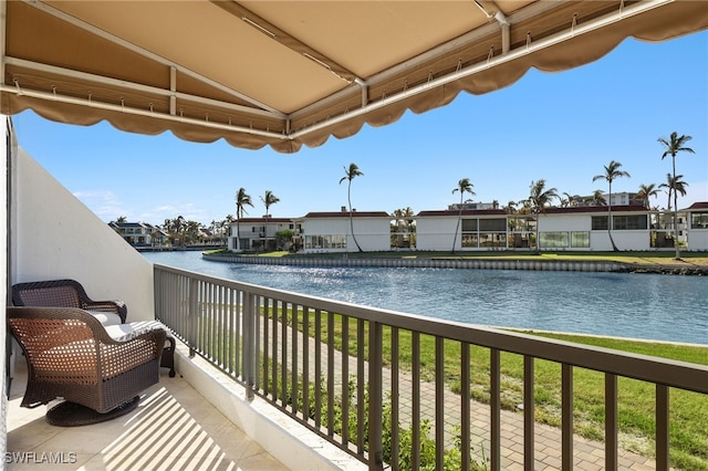 2301 Gulf Shore Blvd N Unit 114, Naples, FL 34103 - balcony with a water view and a residential view