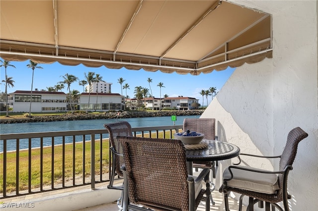2301 Gulf Shore Blvd N Unit 114, Naples, FL 34103 - balcony featuring a water view and a residential view