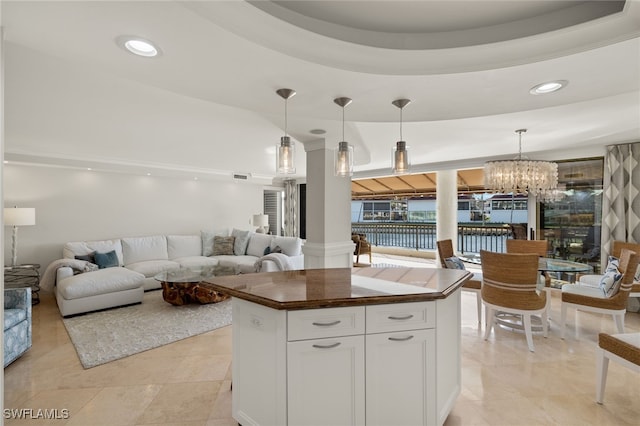 2301 Gulf Shore Blvd N Unit 114, Naples, FL 34103 - kitchen with open floor plan, a chandelier, white cabinets, and recessed lighting