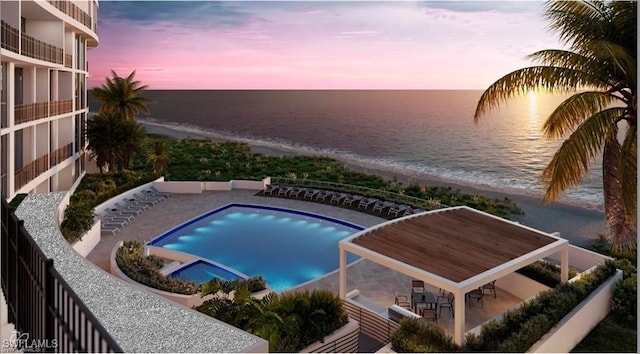2301 Gulf Shore Blvd N Unit 114, Naples, FL 34103 - pool at dusk with view of water and beach, a pool with connected hot tub, and a patio