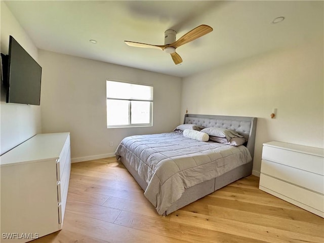 780 Augusta Blvd Unit C204, Naples, FL 34113 - bedroom with baseboards, light wood finished floors, and ceiling fan