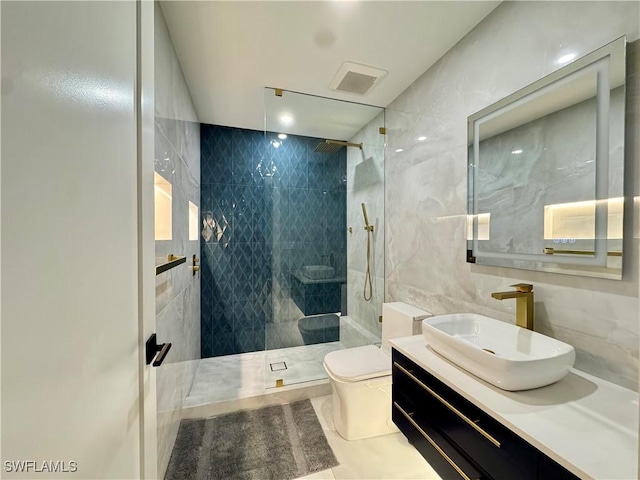 780 Augusta Blvd Unit C204, Naples, FL 34113 - bathroom with toilet, a walk in shower, tile walls, vanity, and tile patterned flooring