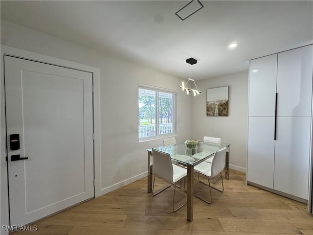 780 Augusta Blvd Unit C204, Naples, FL 34113 - dining space featuring light wood finished floors, baseboards, recessed lighting, and a chandelier