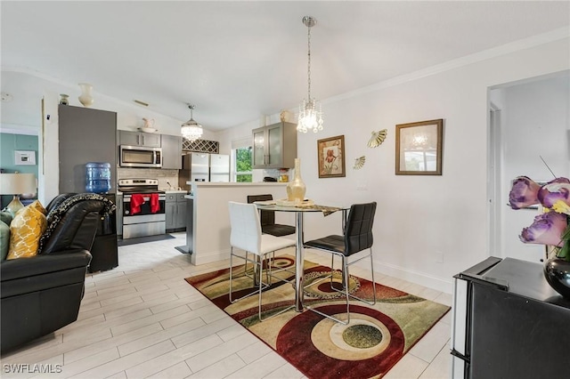 503 E 13th St, Lehigh Acres, FL 33972 - dining area featuring a chandelier, light wood-type flooring, and crown molding