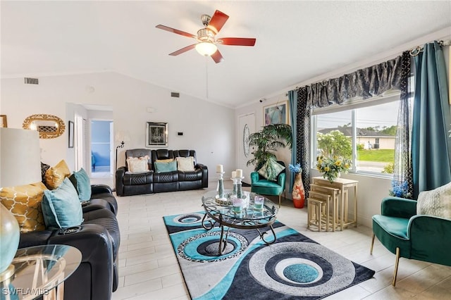 503 E 13th St, Lehigh Acres, FL 33972 - living room with a ceiling fan and vaulted ceiling