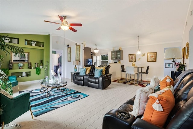 503 E 13th St, Lehigh Acres, FL 33972 - living room with a ceiling fan, ornamental molding, and wood finished floors
