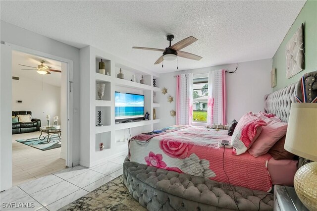 503 E 13th St, Lehigh Acres, FL 33972 - bedroom featuring ceiling fan and a textured ceiling